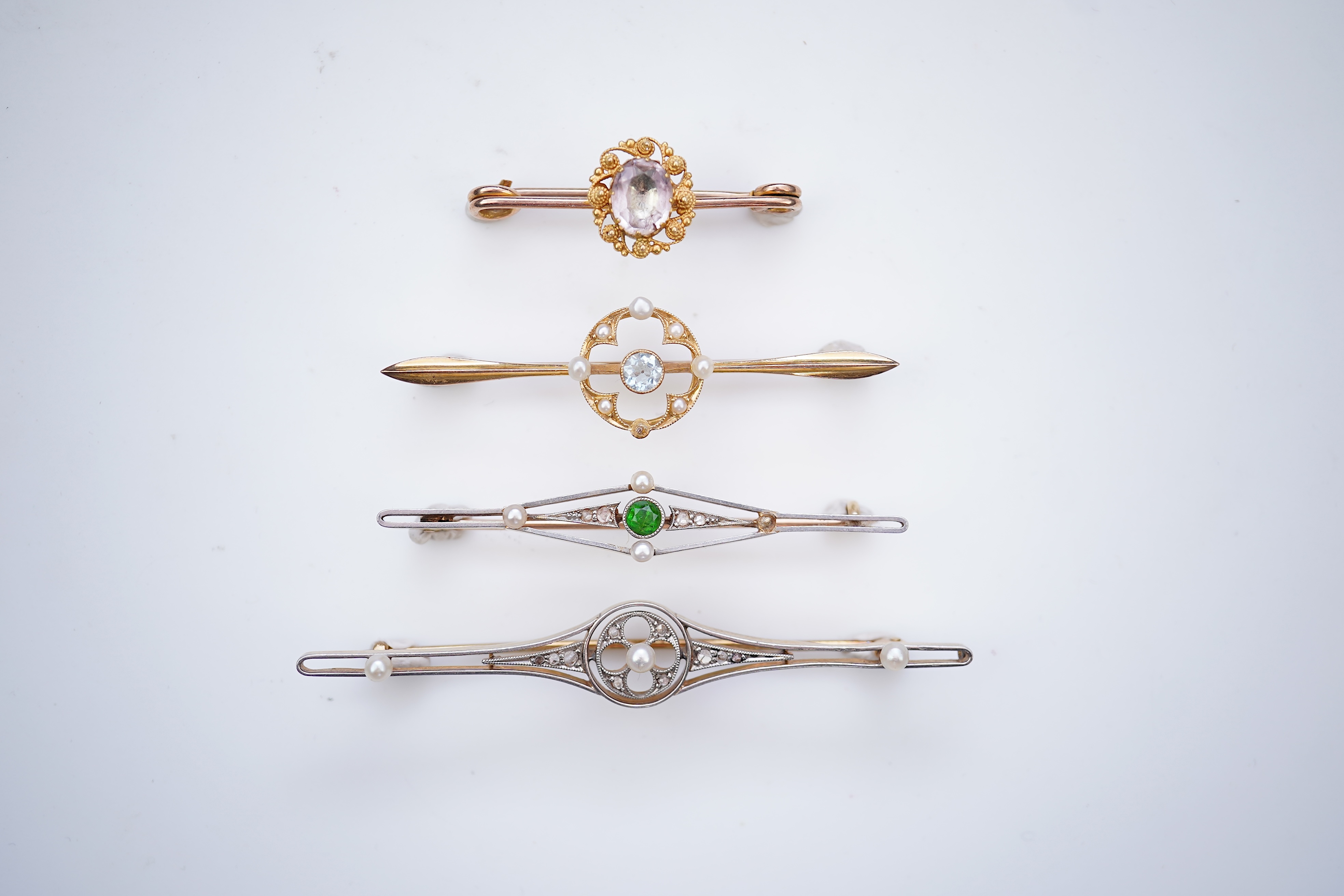 Four gold and gem-set bar brooches, early 20th century